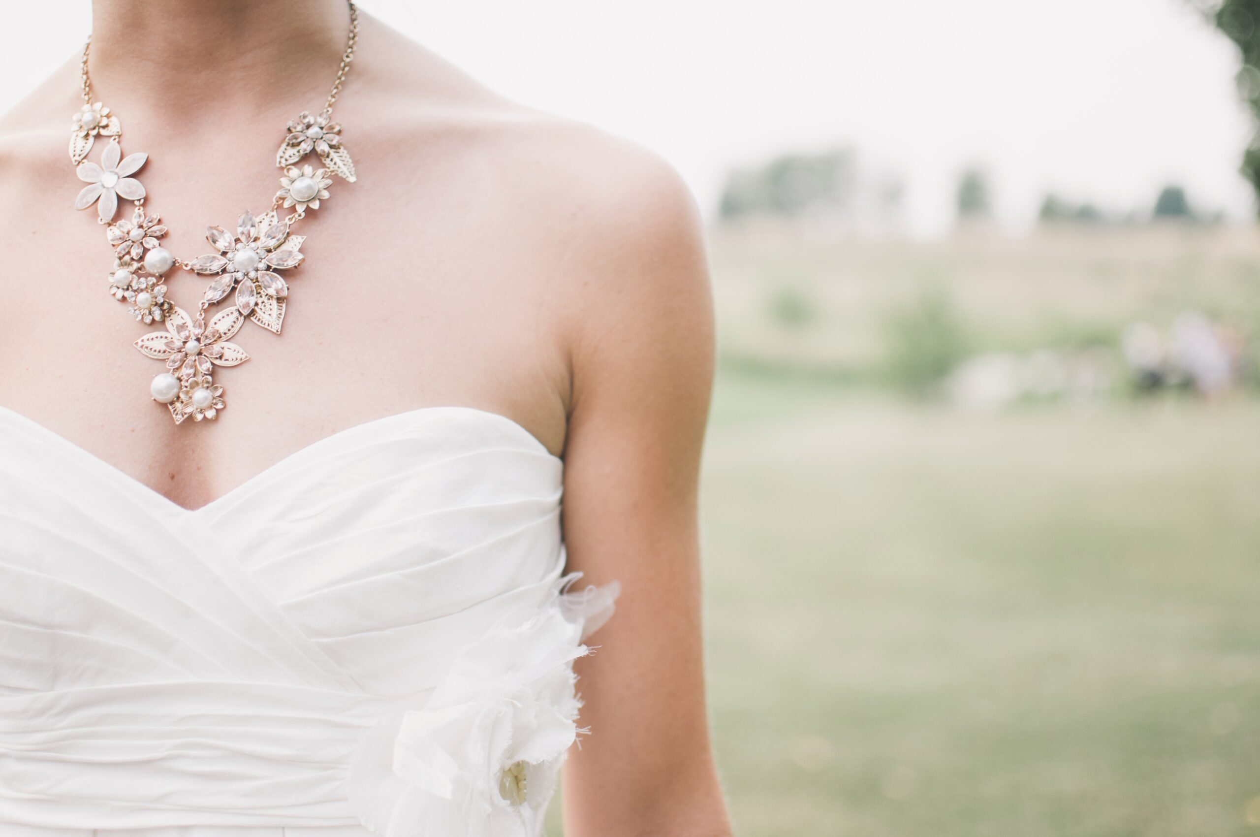 Bride in strapless dress with statement necklace